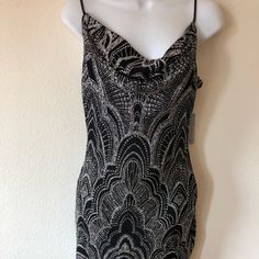 Sparkly Glitter Adorns A Spaghetti Strap Bodycon Dress With A Gently Draped Cowl For Eye-Catching Party Style. Fit: This Style Fits True To Size. - Cowl Neck - Sleeveless - Slips On Over Head - Glitter Embellishment Allover - Stretch Knit Construction - Fully Lined - Approx. 34.5" Length (Size 1-2) - Made In Usa This Item Cannot Be Shipped To Canada. Fiber Content 95% Acetate, 5% Spandex Hand Wash Cold Cowl Neck Mini Dress, Spaghetti Strap Bodycon Dress, Prom 2024, Party Style, Party Fashion, Cowl Neck, Black Silver, Spaghetti Strap, Made In Usa