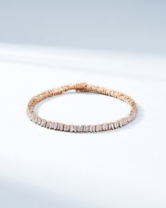 This Classic Diamond Mini Baguette Tennis Bracelet is one of our bestselling styles. We love this piece for its elegance and wear-ability. Beautiful mini baguette diamonds are meticulously set in a vertically staggered setting for a modern feel. Stack it next to one of our bangles for an elevated look. Details 18k rose gold, yellow gold or white gold 2.90 carats of baguette white diamonds Bracelet measures 7" inches in length Box clasp with safety lock fastening Please note, the model is using h Mini Baguette, Diamonds Bracelet, Baguette Diamonds, Box Clasp, Tennis Necklace, Tennis Bracelet Diamond, Classic Mini, Baguette Diamond, Tennis Bracelet