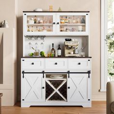 a white cabinet filled with bottles and glasses