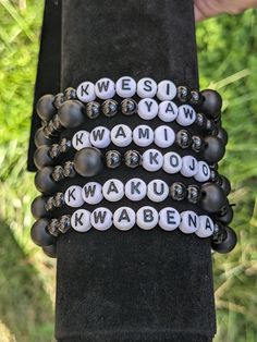 Handmade men's Ghanaian day name bracelet.  Made with matte black onyx beads and black glass beads. Black Round Bead Jewelry With Letter Details, Black Name Bracelet With Round Beads, Black Personalized Name Bracelet With Round Beads, Personalized Black Bracelets With Round Beads, Personalized Black Bracelet With Round Beads, Personalized Black Name Bracelet With Round Beads, Casual Black Stretch Bracelet With Letter Beads, Casual Black Wristband With Letter Beads, Black Letter Round Beads