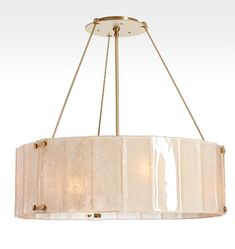 a chandelier hanging from the ceiling with two shades of white and gold on it