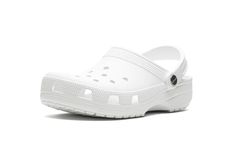 The JJJJound x Crocs Classic Clog “White” is a collaboration by the Montreal design studio on the versatile, popular slip-on sandal by Crocs.  In addition to collaborating with Reebok, New Balance, and other sneaker brands, JJJJound teams up with Crocs on a versatile colorway of the Classic Clog in “White. ” The slip-on features a lightweight, foam-injected mold that features multiple ventilations for breathability.  JJJJound branding is seen on the brass rivets that modulate the heel strap.  Un White Crocs, Crocs Classic Clogs, Stadium Goods, Sneaker Brands, Strap Heels, Rivets, Slip On Sandal, Montreal, New Balance