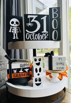 a table with halloween decorations on it and a sign that says happy 31st octer