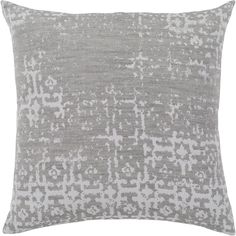 a gray and white pillow with an abstract design on the front, in shades of grey