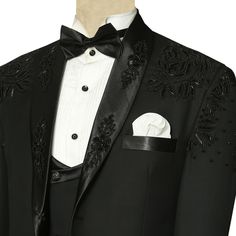 This luxurious black designer tuxedo suit is perfect for any special occasion from weddings and galas to red carpet events. Made with premium Italian wool and hand-embroidered with intricate details, this suit will make you look and feel your best.The tuxedo jacket features a black satin lapel with handwork, single button closure, a pocket square, double flapped pockets, and an inner round lining. It comes with a double-breasted waistcoat with a satin lapel. Pair it with a white tuxedo shirt, bl Luxury Black Suits For Gala Events, Black Double Breasted Suit For Party With Suit Collar, Black Double Breasted Suit For Party, Black Double-breasted Suit With Suit Collar For Party, Black Suits For Black-tie Events And Galas, Black Tuxedo For Wedding And Gala Events, Black Fitted Tuxedo For Gala, Black Blazer For Black-tie Gala Events, Elegant Black Suit For Gala