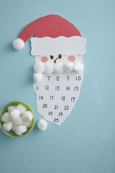 a santa clause clock with marshmallows on the side