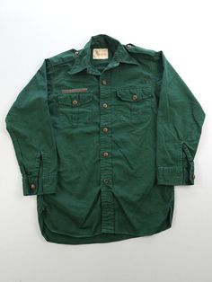 Listing: Vintage 1950s BSA Boy Scouts Of Canada Green Twill Uniform Shirt Youth L Size on Tag: N/A Flaws: No major flaws Measurements: Please see the photos in the listing. If you require additional measurements or information about this item, feel free to send a message. Vintage Cotton Collared Shirt, Vintage Green Shirt, Vintage Long Sleeve Tops With Pockets, Retro Cotton Shirt With Pockets, Vintage Fitted Shirt With Pockets, Vintage Fall Shirt With Pockets, Retro Cotton Shirt With Buttons, Vintage Cotton Shirt For Fall, Vintage Fall Shirt With Buttons