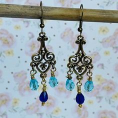 Chandelier Brass Beaded Blue Czech Crystals Dangle Lightweight Pierced Earrings 1 3/8” New Beautiful And Unique, Very Lightweight, Great For Any Season And Occasion; Handmade, Never Worn; Smoke/Pets Free Home. Handmade Hand Crafted Fashion Jewelry Earrings Dangle Drop Pierced Artisan Sustainable Gift Mother's Day Unique One Of A Kind Unique Bohemian Beaded Crystal Gemstone Organic Statement Blue Metal Teardrop Chandelier Earrings, Blue Teardrop Metal Chandelier Earrings, Blue Dangle Crystal Earrings With Dangling Beads, Blue Crystal Dangling Earrings, Blue Metal Chandelier Earrings With Dangling Beads, Blue Metal Chandelier Earrings With Ear Wire, Blue Beaded Metal Chandelier Earrings, Vintage Blue Beaded Drop Earrings, Handmade Blue Teardrop Chandelier Earrings