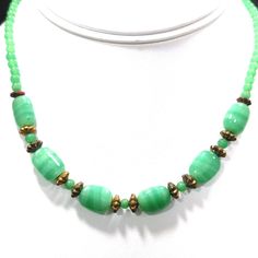 *Description: This necklace is made from faux jade green glass beads that have small air bubbles in them from the 1930s or before. They would be perfect to restring as they are most likely antique beads and the metal plated findings did not hold up as well as the glass beads. Unchecked from a gem tester, you would believe these to be jade but they are indeed glass. Looking closely with a loop, you can see the air bubbles within many of the glass beads. The necklace is 15 inches in length. This w Vintage Czech Glass Oval Beaded Necklace, Green Oval Jade Beads Jewelry, Adjustable Vintage Jade Necklaces, Adjustable Vintage Jade Necklace, Vintage Adjustable Jade Necklaces, Vintage Adjustable Jade Necklace, Vintage Jade Beaded Necklaces, Vintage Jade Beaded Necklace, Vintage Green Oval Beads Jewelry