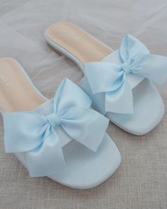 Classic slide flat sandals for casual and dressy look with added SATIN BOW. Simple and easy wear for brides, bridesmaids and wedding parties.DETAILS:COLORS AVAILABLE: Ivory, Light Blue, White, Pink, and ChampagneUPPER: Synthetic upper and liningMATERIALS: Mandmade outsole STYLE NAME: EVELYN Bridesmaid Sandals, Bridal Floral Crown, Bridal Sandals, Prom Dress Inspiration, Wedding Sandals, Satin Slip, Cute Sandals, Shoe Inspiration, Blue Sandals