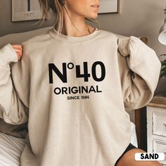 Looking for a unique and personal 40th birthday gift? Look no further than this cute No 40 Original sweatshirt! It's the perfect way to show your loved one how much you care on their special day. Not only is it stylish, but it also makes a great gift for her birthday or any other special occasion.  * Q U I C K * F A C T S * ✺ 50% cotton, 50% polyester ✺ Medium-heavy fabric ✺ Wash and dry normally (on cool for best results) ✺ Product color may slightly vary due to photographic lighting sources or Funny 40th Shirts, 45th Birthday Shirt Ideas For Women, Funny 50 Year Old Shirts, 60th Birthday Tshirt Ideas For Family, Big 40 Birthday Ideas For Women, 40th Birthday Sweatshirt, Birthday Sweatshirt Ideas, 40th Birthday Tshirts Woman, 40tg Birthday Ideas For Women