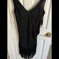 Lovely Fringed Black Short Dress Size Small Never Worn New With Tags Black V-neck Flapper Dress For Party, Black V-neck Flapper Dress For Evening, Fitted V-neck Flapper Dress For Night Out, Elegant Fitted Flapper Dress For Night Out, Elegant V-neck Flapper Dress For Night Out, Black Fitted Flapper Dress For Party, Fitted Black Flapper Dress For Party, Fitted Flapper Dress For Holiday Evening, Fitted Flapper Evening Dress For Holiday