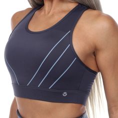 A lycra sports bra featuring a mesh and peek-a-boo cut out back, distinctive piping, and a scoop neckline for comfort and detail. Enjoy a good workout in our breathable and extra supportive padded sports bra. Also features a keyhole in the back for added breathability. The hook closure really customizes the bra to fit your body perfectly. Fitness Leggings, Padded Sports Bra, Out Back, White Mark, Sports Top, Peek A Boo, Active Women, Bra Lingerie, Moisture Wicking Fabric