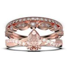 a rose gold ring set with an oval cut diamond and two rows of diamonds on each band