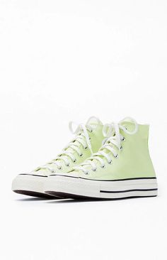 Step into timeless style with Converse's Lime Chuck Taylor All Star 70 High Top Sneakers. These iconic kicks blend vintage aesthetics with modern comfort, featuring premium materials and the classic Chuck Taylor design that effortlessly elevates your casual look..PLEASE NOTE: This shoe is offered in men's sizes; the conversion for Converse shoes is a size and a half smaller for women. For example, a woman who is a size 7 should order a size 5.5 in men's..Canvas upper.Lace-up front closure.High-top silhouette.Contrast stitching.Metal eyelets.Converse branding.Chuck Taylor All Star ankle patch Retro High-top Spring Sneakers, Retro High-top Sneakers For Spring, Retro Green Sneakers With Speckled Midsole, Green Converse High-top Sneakers For Spring, Vintage Green High-top Sneakers With Rubber Sole, Green Vintage High-top Sneakers With Rubber Sole, Retro Converse Sneakers For Spring, Retro High-top Sneakers For Spring Streetwear, Spring Green Converse High-top Sneakers