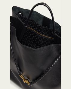 Bottega Veneta "Andiamo" tote bag in silky calf leather     Top handle     Sliding shoulder strap with knot hardware accent     Can be worn as a top handle or shoulder bag     Open top     Interior, one zip pocket and one card slot     Lining: Suede    Feet protect bottom of bag     Approx. 13.7"H x 16.5"W x 7"D    Made in Italy Designer Top Handle Hobo Bag For Daily Use, Designer Hobo Bag With Top Carry Handle For Shopping, Designer Hobo Bag With Double Handle For Daily Use, Luxury Bucket Tote Bag, Luxury Top Handle Hobo Bag For Shopping, Designer Travel Shoulder Bag With Round Handle, Designer Hobo Tote Bag With Top Carry Handle, Luxury Rectangular Hobo Bag With Handle Drop, Designer Hobo Bag With Removable Pouch