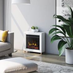 a living room with a couch, chair and fire place