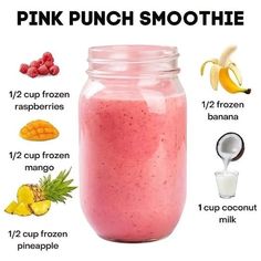 a pink smoothie in a mason jar with ingredients to make it