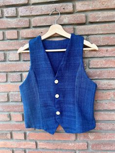 The Laosiana waistcoats were made from our handwoven cotton, very comfy to fit on this summer.  Available now in all colors  - Sand - Indigo -Olive green - Burlywood - Leaf green - cinnamon size  S ( bust 80-85cm, waist 60- 65cm) size M ( bust85-90cm, waist 65-70cm) size L ( bust90-95cm, waist 70-75cm) size XL (bust 95-100cm, waist 75-80cm)  feel free to contact us for more specific sizing and customize according to your body Transparent pricing:  Fabrics and trims: 15€ ✂️Cut and make: 30€ Packa Sleeveless Cotton Tops With Natural Dye, Sleeveless Cotton Top With Natural Dye, Traditional Cotton Vest For Summer, Traditional Cotton Nehru Jacket For Summer, Sleeveless Cotton Nehru Jacket For Spring, Body Transparent, Girls Clothing Sets, Clothing Sets, Summer Top