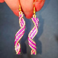 Elevate Your Accessory Collection With These Exquisite Handmade Pink And Gold Woven Earrings, Crafted From High-Quality Japanese Glass Miyuki Delica Beads. Measuring Approximately 2.25 Inches, These Beaded Spiral Earrings Showcase A Unique Design That Combines Elegance And Artistry, Making Them A Perfect Statement Piece For Any Occasion. Their Vibrant Colors And Intricate Craftsmanship Ensure That They Will Stand Out, Adding A Touch Of Sophistication To Your Ensemble. Pink Wire Wrapped Beaded Earrings With Round Beads, Pink Wire Wrapped Beaded Earrings, Spiral Pink Jewelry For Gifts, Pink Spiral Jewelry For Gifts, Pink Beaded Earrings With Ear Wire For Party, Pink Wire Wrapped Earrings For Party, Party Pink Wire Wrapped Earrings, Miyuki Earrings, Woven Earrings