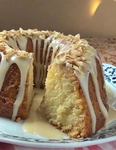 a bundt cake with white icing on a plate