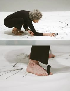 a woman is drawing on the ground with her hands and feet in front of her