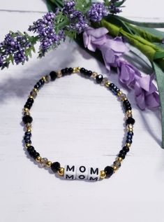 Personalized Mothers Day Bracelets are the best gift ever! With these beautiful beaded bracelets you can choose the color and the name you call you mom. Mom, Mama, Mommy, Mother, Bonus Mom...you can customize it however you like. This listing is for one bracelet made with assorted seed beads, glass beads, and either gold or silver metal accent beads. In the center is the word of your choice made with square white plastic beads with black lettering. Each bracelet is made on stretchy fiber elastic Mothers Day Bracelets, Mothers Day Jewelry, Mothers Day Present, Mama Bracelet, Mom Bracelet, Beautiful Beaded Bracelet, Best Gift Ever, Bonus Mom, Moms Bracelet