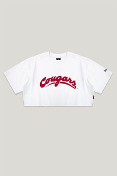 The Track Top! A drop shoulder jersey tee with a raw hem, inspired by vintage styles. SIZING AND DETAILS Sizing: XS-XXL Relaxed, oversized fit 100% Cotton Screenprint, Heat Transfer Vinyl logo application P.S. We’d love to see you repping this style! Make sure to tag us (@hypeandvice) to be featured :) Cotton Cropped T-shirt With Logo For Streetwear, Oversized Collegiate Top With Graphic Print, Collegiate Oversized Top With Graphic Print, Oversized Cotton Collegiate Top, Oversized Collegiate Cotton Top, Sporty White Tops For Campus, Relaxed Fit Cropped T-shirt With Logo For Streetwear, Streetwear Graphic Tee With Crew Neck, Varsity Crew Neck Tops With Embroidered Graphics