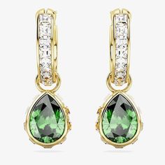 The Swarovski Stilla Drop Hoop Earrings feature a captivating green Swarovski crystal, skilfully crafted in a pear cut, radiating a sense of enchanting allure. The gold-tone plated finish adds a touch of luxury, making them versatile for both casual and sophisticated occasions. Indulge in the fusion of contemporary and timeless style, as these earrings effortlessly become your signature accessory. Size: 2.2 x 0.7cm Weight (individual piece): 1.7g Item Code: 5662922 Solitaire Earrings, Crystal Hoop Earrings, Mini Hoop Earrings, Sell Gold, Swarovski Earrings, Swarovski Jewelry, Crystal Charm, Polish Jewelry, Pear Cut