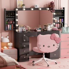 a hello kitty desk and chair in a room with pink walls, drawers, and lights