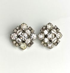 Fabulous retro earrings signed La Rel A 1" square to wear as a diamond shape clip on earring Silver tone metal with clear rhinestones playing with the light with elegance. In great condition with expected signs of wear. 2 rhinestones have a light yellow tone color, giving a unique vintage look. ask any questions or additional photos. Comes in a gift box Yellow Tone Color, Mid Century Earrings, Retro Earrings, Clip On Earring, Yellow Tone, Vintage Jewelry Earrings, Earring Silver, Retro Earring, Jewelry Bridal