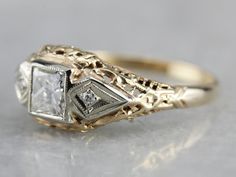 Vintage meets modern in this 1920's Art Deco era ring! This mounting dates to the late Art Deco era, or 1930's, and was likely set with a synthetic sapphire when it was crafted. We've removed the original stone and replaced it with a new, sparkling Square Cut Diamond. This ring sits nearly flush to the finger, and protects the stone quite well. This would work well as an alternative style engagement ring or wedding band! Metal: 14k Yellow Gold with White Gold Accents Gem: Diamond .50 Carats, VVS Vintage Art Deco Engagement Ring 1920s, Antique Square Engagement Rings, Art Deco Vintage Engagement Ring, Art Deco Rings Vintage, Vintage Art Deco Wedding Ring, 1930 Engagement Ring, Art Deco Mens Ring, Vintage Art Deco Ring, Art Deco Vintage Ring