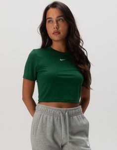 Nike Sportswear Essential Slim Crop Tee. Embroidered Nike Swoosh Logo On Center Chest. Ribbed Crew Neckline. Short Sleeve. Slim Fitting, Cropped Fit. 49% Polyester, 48% Modal, 3% Spandex. Machine Wash. Imported. Model Is Wearing A Size Small. Model Measurements:height: 5'7" Bust: 34"waist: 25"hips: 34.5" Casual Cropped Crew Neck T-shirt For Workout, Sporty Workout T-shirt, Spring Gym T-shirt With Crew Neck, Green Sportswear T-shirt For Sports, Spring Athleisure Cropped T-shirt For Sports, Nike Cropped Short Sleeve T-shirt For Sports, Sporty Cropped T-shirt For Spring Workout, Spring Sports Event Tops, Solid Color Sporty Streetwear Tops