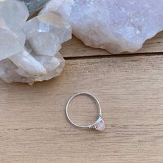 💓Wire Wrapped Rose Quartz Crystal Ring - 1 Ring💓 *these beads are a little more pink than the photo captures, it was hard to capture in this lighting This ring features a natural (not dyed) tiny 4mm rose quartz crystal bead, wrapped in your choice of wire. The options are silver plated, copper, bronze, black, or gold colored wire. All except the silver plated have a non tarnish coating so they will never oxidize or change color. Being careful to not wear your rings while showering or washing y Rose Quartz Crystal Ring For Promise, Promise Ring With Rose Quartz And Gemstone Detail, Minimalist Pink Crystal Ring As Gift, Pink Rose Quartz Hand Wrapped Jewelry, Hand Wrapped Rose Quartz Pink Jewelry, Pink Sterling Silver Moonstone Promise Ring, Hand Wrapped Pink Rose Quartz Jewelry, Pink Rose Quartz Birthstone Jewelry, Adjustable Pink Moonstone Round Ring