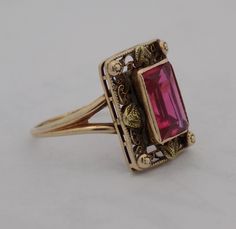 Ladies 10 karat synthetic ruby ring. The ring contains a rectangular ruby surrounded by a filigree shadow box with small gold ornamental knobs at the corners and at the center points of the milgrain edged box. The edwardian style antiqued ring is size 5.25. Antique Ruby Ring, Ring Jewellery Design, Edwardian Style, Antique Ring, Edwardian Fashion, Jewel Box, Small Rings, Jewellery Design, Ruby Ring