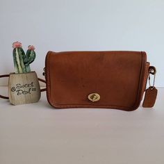 Vtg Classic Original Coach Kisslock DinkyLeather with brass hardwareRoomy interior with 1 slip pocket, attached kisslock coin pouch, outer slip pocket divided in two covered by a flap and secured with a turnlockDetachable 39" strapMeasures: 8"L, 5"H, 2"WMade in New York, USA#348-4644Flaws: 2 slots of leather in front, stains on front and stains on top and backCleaned, conditioned and ready to wear!Questions? Just askMore vtg coach colors/styles also availableRc029 Vintage Rectangular Flap Bag With Gold-tone Hardware, Vintage Shoulder Flap Bag, Vintage Bag With Flap And Detachable Strap, Vintage Flap Bag With Detachable Strap For Formal Occasions, Vintage Rectangular Shoulder Bag With Turn-lock Closure, Vintage Crossbody Flap Bag With Detachable Strap, Vintage Rectangular Flap Bag For Travel, Vintage Crossbody Flap Bag, Vintage Flap Shoulder Bag With Detachable Strap