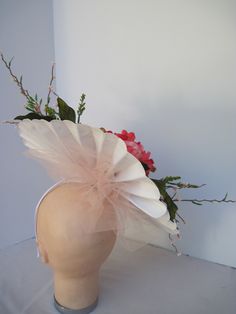 "* This pleated polka dot hat base has a 14\" diameter and has a jumbo 6\" diameter upscale silk peachy pink Peony flower accented with spikes of pastel pink flower vines and spring greens. * Peach millinery netting adds more height and drama to the headpiece. * On a metal headband with a satin ribbon covering it is secure, well balanced and comfortable to wear for extended periods of time. * Upon ordering you will receive this exact headpiece. * Perfect for the Kentucky Derby, Day at the Races, Cream Fascinator For Spring Garden Party, Spring Cream Fascinator For Garden Party, Spring Garden Party Cream Fascinator, Cream Headpiece For Spring Garden Party, Whimsical Fitted Fascinator For Spring, Cream Adjustable Fascinator For Spring, Whimsical Spring Fascinator For Races, Fitted Whimsical Spring Fascinator, Spring Cream Fascinator With Curved Brim