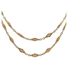 This elegant French Art Nouveau Fancy Chain Link Necklace measures 34 inches in length and is crafted in 18 karat yellow gold. Featuring beautiful intricate and ornate chain links that reflect the organic and flowing forms characteristic of the Art Nouveau movement. The fluidity of the design make this necklace a timeless piece, perfect for adding to a nice necklace stack as a double layer or one long single strand. Art Nouveau necklace, 18 karat gold, French jewelry, vintage chain link necklace Victorian Gold Necklace With Figaro Chain, Victorian Yellow Gold Chain Link Jewelry, Victorian Gold Chain Necklace With Oval Links, Antique Formal Chain Necklaces, Antique Figaro Chain Necklace For Formal Occasions, Antique Figaro Chain Necklace, Gold Filigree Oval Link Jewelry, Antique Figaro Chain Link Necklace, Antique Figaro Link Chain Necklace