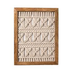 a wooden frame with a crochet pattern on it