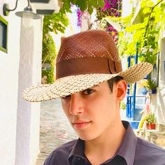 Authentic panama fedora made in natural straw in brown and beige colors. Finished with a quality brown grosgrain ribbon of 4 centimeters wide.Beautiful summer hat for men and woman.The measurements in centimeters are 36 x 34. Brim length 9.5. (These measurements may vary slightly depending on the size of the hat)For its elaboration we only use hoods and capelines of resistant natural straw  (genuine paja toquilla) of very good quality.In our workshop in the Pyrenees we sew and make one by one ou Travel Fedora With Upf 50+ In Brown, Short Brim Hat With Uv Protection For Travel, Brown Flat Brim Panama Hat With Upf 50+, Classic Travel Hats With Uv Protection, Curved Brim Panama Hat With Uv Protection For Travel, Brown Brimmed Fedora With Upf 50+, Brown Toquilla Straw Sun Hat For Travel, Uv Protection Panama Hat With Curved Brim For Travel, Brown Toquilla Straw Panama Hat For Outdoor