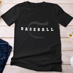 Baseball shirt. Baseball lovers shirt. Sports lovers shirt. Baseball fans shirt. Baseball player shirt. Baseball supporters shirt. Baseball shirt for men. Baseball shirt for women. Baseball dad shirt.  Baseball cool design. Suitable outfit for women, men, girls, boys, baseball lovers, baseball player on holiday, birthday.  🌟 Welcome to SOUQUSA4U! We're excited to bring you premium, ethically crafted cotton T-shirts designed for both comfort and style. Every shirt is made with care and attention to detail, tailored just for you. 📏 PRODUCT INFORMATION & SIZING: Please refer to the Size chart in the images above to find your perfect fit. 🛒 HOW TO PLACE YOUR ORDER: Choose your preferred T-shirt size and color. Select the quantity you want. Click "Add to Cart." For multiple items, simply ret Black T-shirt With Logo For Baseball Season, Black Team Spirit T-shirt With Letter Print, Sporty Short Sleeve T-shirt For Sports Season, Black T-shirt With Letter Print For Game Day, Black Sports Fan T-shirt For Sports, Black Sports T-shirt With Text Print, Sports Fan Black T-shirt, Black Sports Fan T-shirt, Black Crew Neck T-shirt For Sports Events