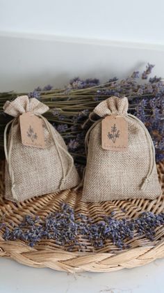 two lavender sacs sitting on top of a wicker basket