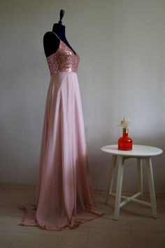 a dress on display next to a table