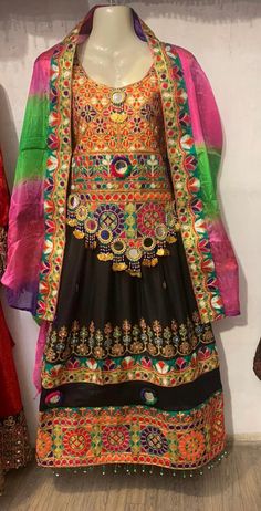 Our traditional Afghan/Pashtoon dress/frock is handmade by our talented artisans in Swat valley. Featuring beautiful Swati Hand embroidery and a fine quality crinkle fabric. These latest design frocks are currently very high in demand and commonly used as wedding dress , party wear, For Nikah and Mangni and Mehndi night events. The dress measurements are kept average. This Dress comes in three pieces 1: Qamees (Shirt) 2: Shalwar (Paint/Trouser) 3: Dupatta (Shawl) NOTE: We can happily create and design your custom orders. Show us a design and we won't disappoint you. Semi-stitched Embroidered Festival Dress, Bohemian Semi-stitched Multicolor Embroidered Dresses, Unstitched Dresses With Multicolor Embroidery For Navratri, Unstitched Multicolor Embroidered Dress For Navratri, Bohemian Lehenga With Resham Embroidery For Traditional Ceremonies, Bohemian Lehenga With Resham Embroidery For Ceremonies, Ceremonial Multicolor Traditional Wear With Dabka Work, Multicolor Dabka Lehenga For Traditional Ceremonies, Traditional Multicolor Dabka Choli