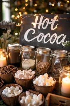 hot cocoa and marshmallows are on display in front of a sign that says hot cocoa