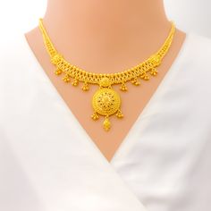 Weighing 33.2 grams of 22k yellow gold, this radiant necklace set showcases a graceful floral design, adding elegance and charm to any occasion. The necklace, with a length of 16 inches and a 1.4-inch drop, features intricate floral patterns that exude timeless beauty. The adjustable 0.75-inch links and hook lock provide both a secure and flexible fit. Accompanied by matching earrings, each measuring 1.75 inches with secure screw-back posts, this set is ideal for special occasions, offering a co 22k Gold Necklace Set, 22k Gold Necklace, Bridal Jewelry Necklace, Precious Stones Rings, Diamond Pendant Sets, Fancy Necklace, Fancy Rings, Mens Gold Rings, Diamond Necklace Set