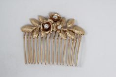 This stunning roses, leaves and faux pearls comb is now available for a budget friendly price since the plating is not real gold/ rose gold/ silver plating but rather a high quality matte gold/ rose gold/ silver color with a lacquer finish, and the pearls are a high quality faux pearls instead of fresh water pearls.Measurements: around 3 inch * Comes wrapped in a beautiful gift package.For updates, new products, one-of-a-kind's, special offers and more- like me on Facebook:https://www.facebook.c Floral Bridal Comb, Amber Hair, Pearl Comb, Bridesmaid Hair Accessories, Flower Hair Comb, Bridal Comb, Fresh Water Pearls, Gift Package, Water Pearls