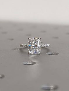 an engagement ring with a princess cut diamond