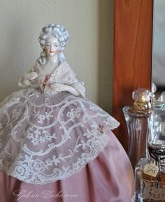 a figurine sitting on top of a table