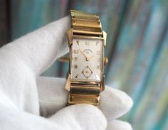 LORD ELGIN 14K solid gold case , cal. 670, U.S.A   Art Deco mechanical wind up  men's watch case: 19x26mm 36mm lug to lug dial: 17x23mm 9mm thickness with the glass 14K solid gold case Condition: checked and serviced, perfect working and good cosmetic condition, some signs of age and use See more of our watches: https://www.etsy.com/shop/RetroWatchMZLtd Bangle Watches, Mens Wrist Watches, Usa Art, Gold Case, Wristwatch Men, Watch Case, Wrist Watches, Men's Watch, Quartz Watch